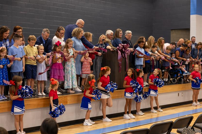 Students cut ribbon at new school